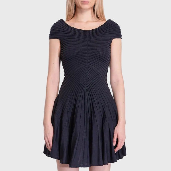 Navy blue dress worn by a model on a white background