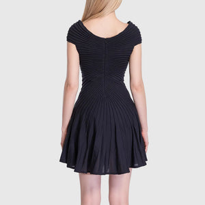 Navy blue dress with pleated back on a white background