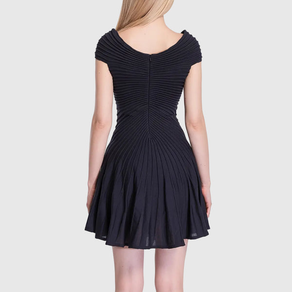 Navy blue dress with pleated back on a white background