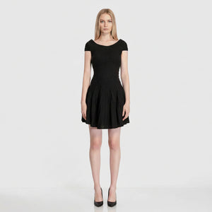 Navy blue dress worn by a model on a white background