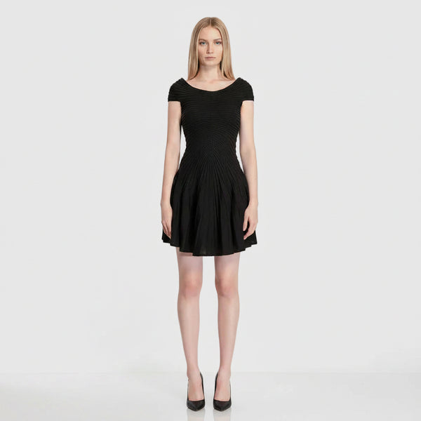 Navy blue dress worn by a model on a white background