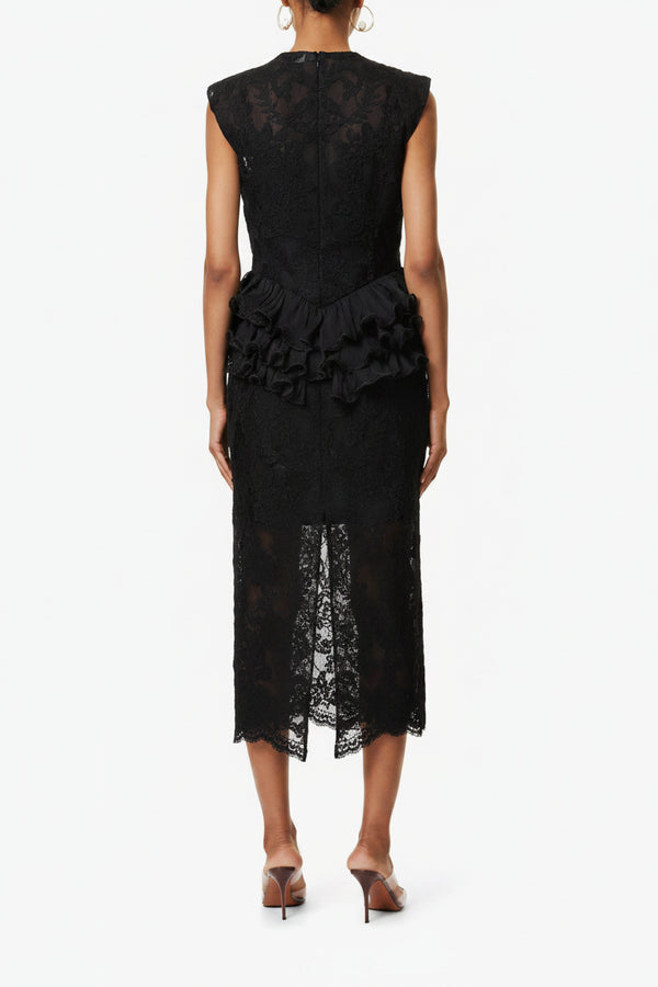 Black lace dress with ruffled details on a white background